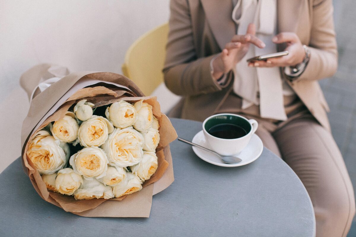 Kraft paper bouquet, coffee, female office worker